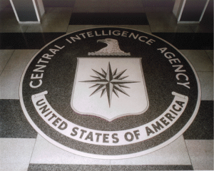 The seal of the Central Intelligence Agency inlaid in the floor of the main lobby of the Original Headquarters Building. Photo by user:Duffman (Own work) [Public domain], via Wikimedia Commons