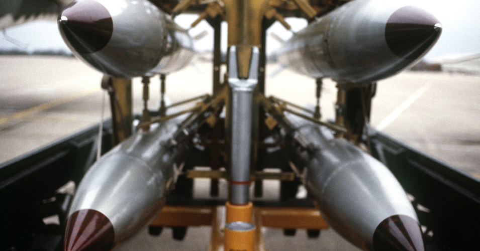 A frontal view of four B-61 nuclear free-fall bombs on a bomb cart. (DoD photo)