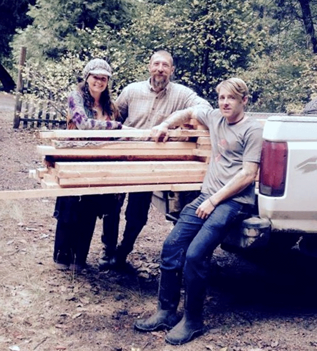 Matt Musselwhite, right, with neighbors who helped mill five local trees into lumber. Photo courtesy of Matt Musselwhite.